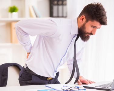 Why is lower back pain considered one of the hardest conditions to address?